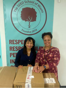 Two teaching microscopes presented to students at the SEED School of Miami